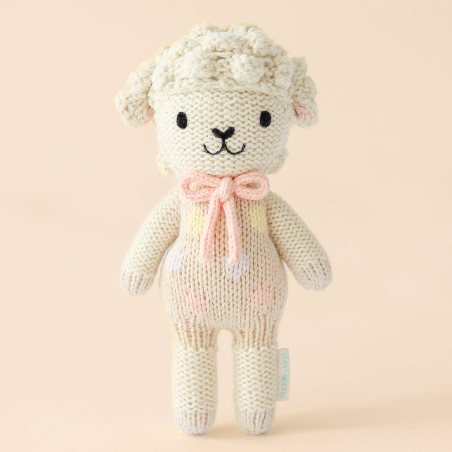 Tiny Lucy the lamb (pastel), gives 10 meals, cuddle + kind