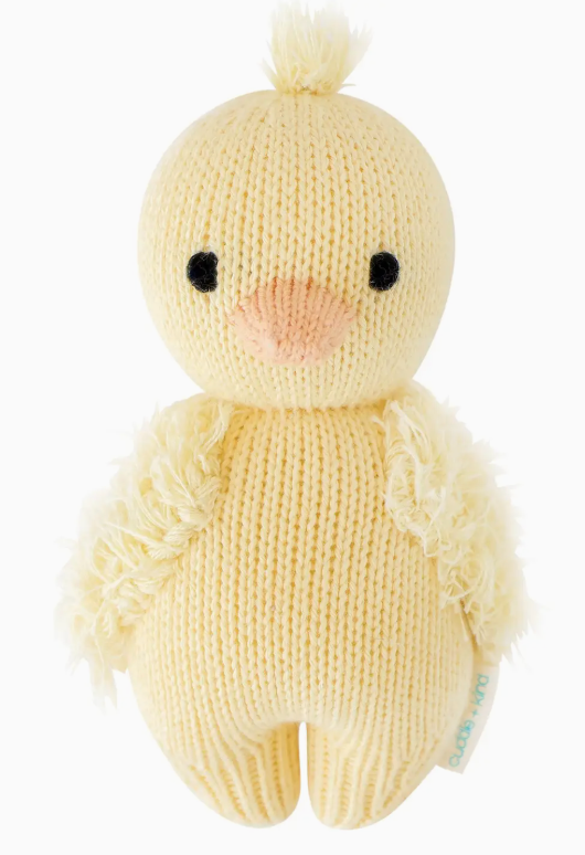Cuddle + kind baby duckling