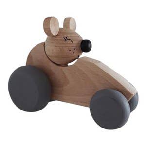 Wooden mouse in a natural car