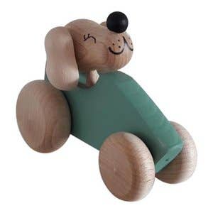 Wooden dog in green car